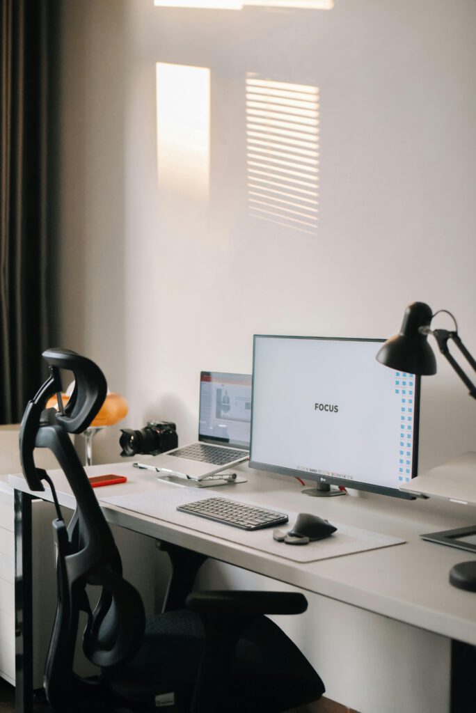 A clean and minimalist home office setup with a focus on productivity and modern technology.
